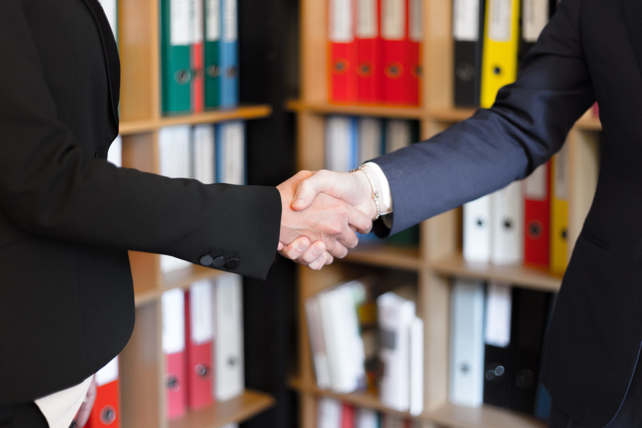 two-people-shaking-their-hands-2058148